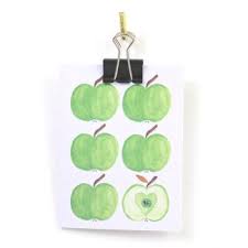 Litet kort med gröna äpplen